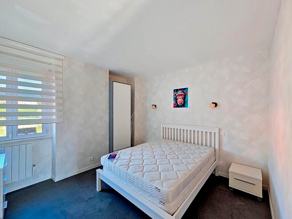 Chambre confortable de l’appartement Le Frêne à Évaux-les-Bains